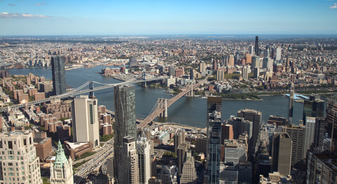 Aerial view of Manhattan, NYC, where commercial real estate investment opportunities persist despite market challenges.