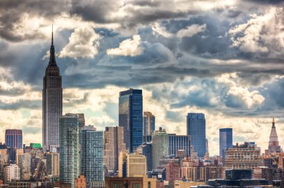 Dynamic NYC Manhattan Skyline Illustrates Commercial Real Estate Growth Amid Challenges.