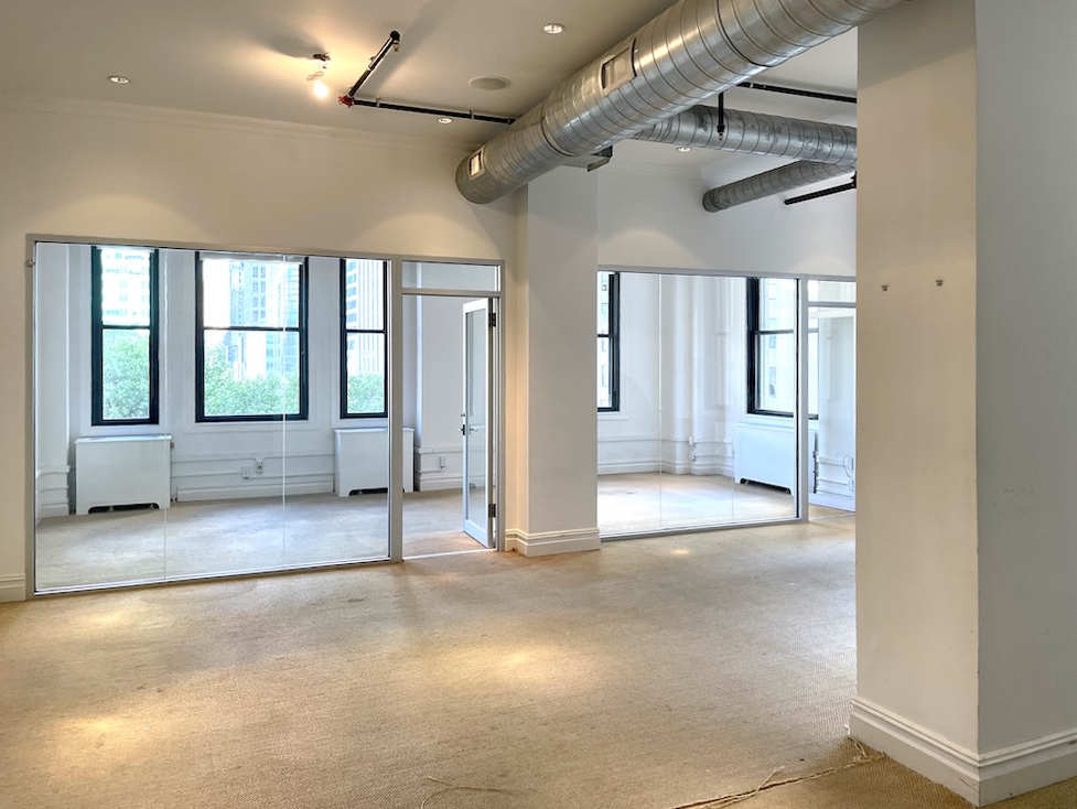 Office space in a Class B building at 501 Fifth Avenue, including a large conference room.