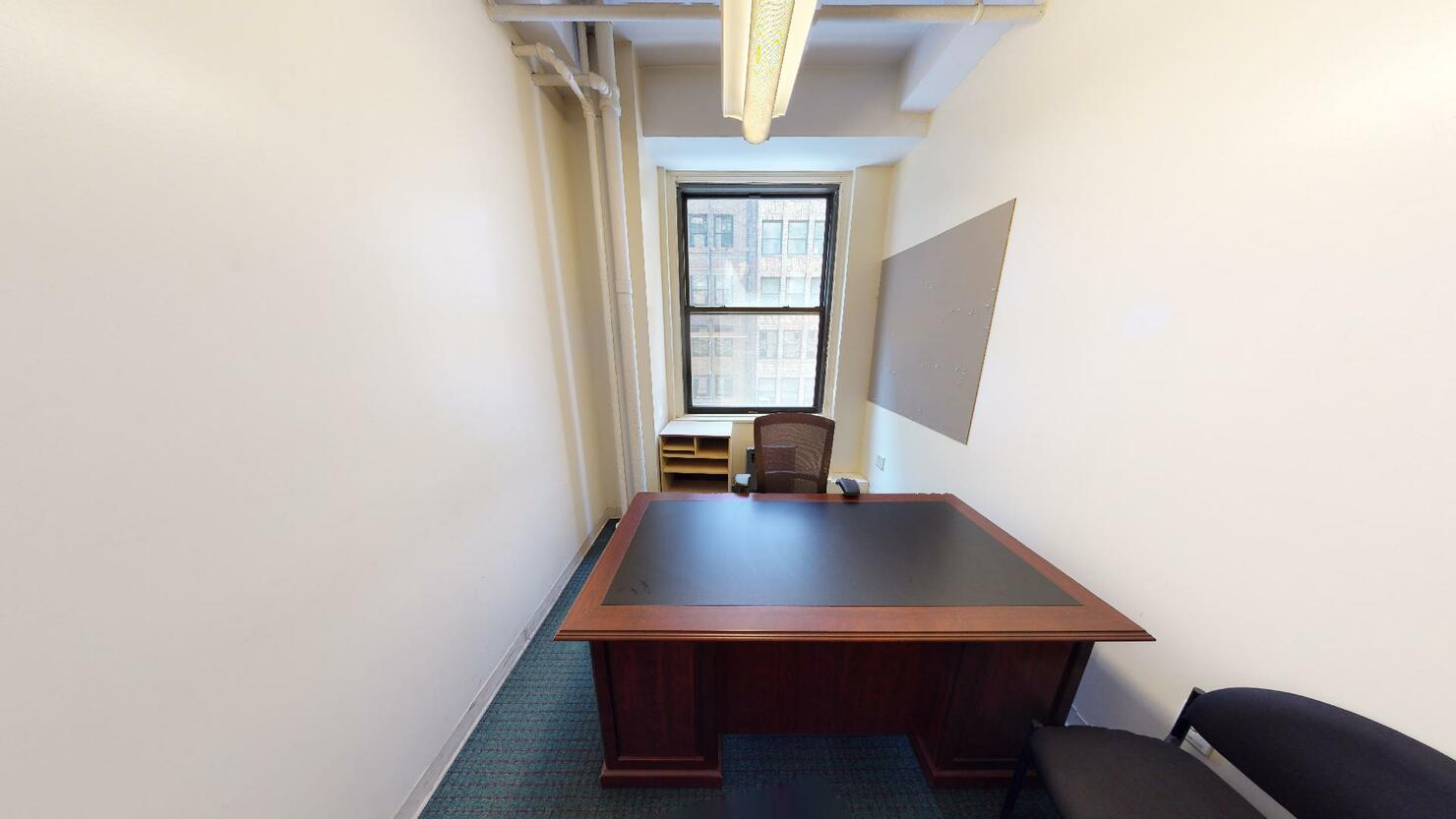 247 West 35th Street Office Space - small private office room with a desk and two chairs