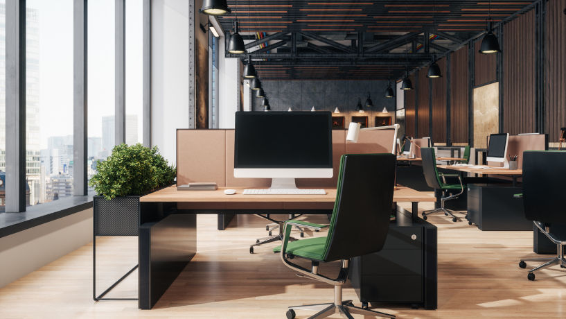 Modern open-plan office interior: dark gray furniture with cityscape view