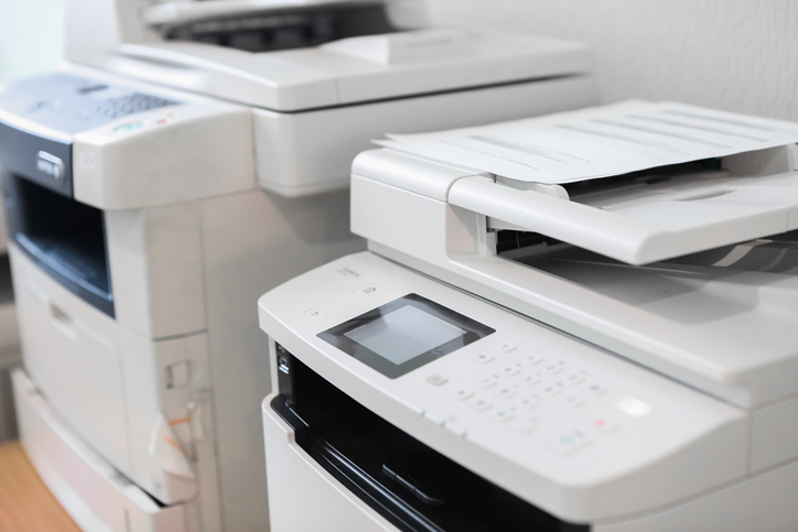 Close-up of two universal office printers