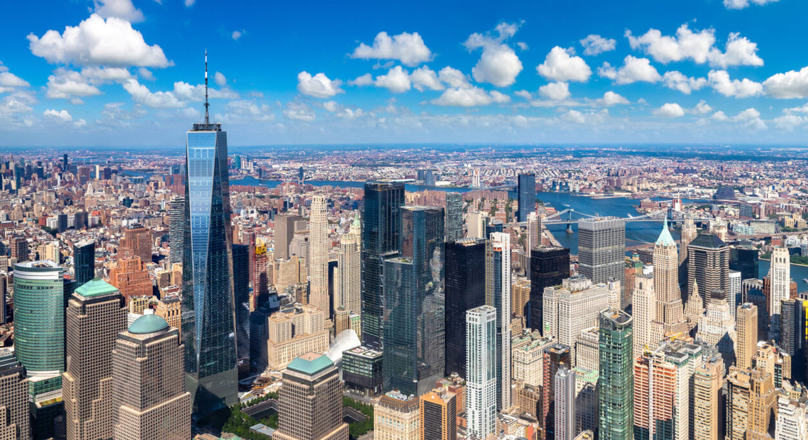 Panoramic aerial view of Manhattan's thriving high-end office market with One World Center.